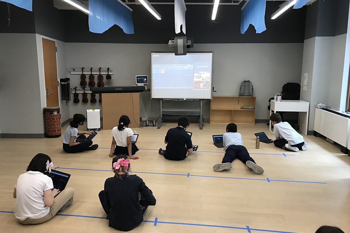 Students sitting on the floor