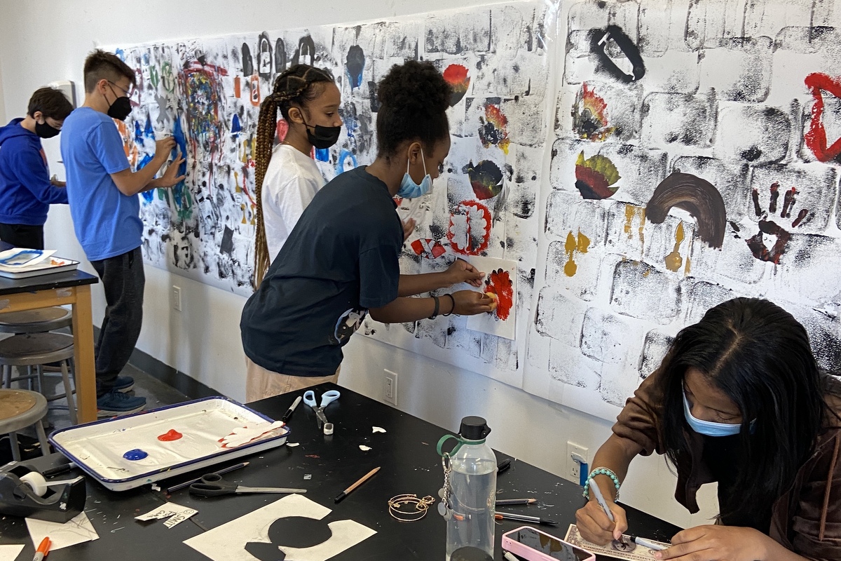 Kids working on a mural