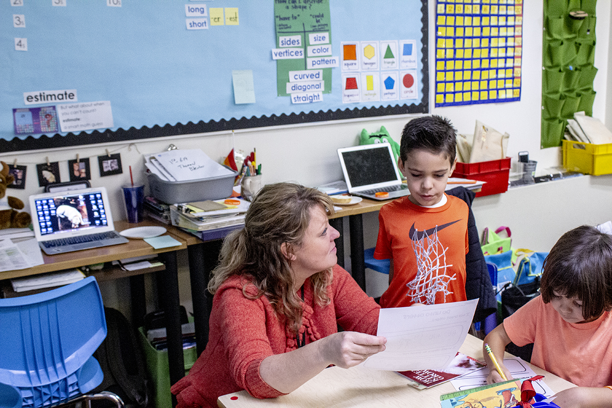 Student and teacher work together in a classroom