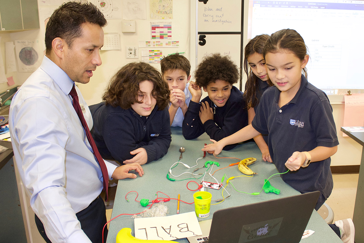 Students and teachers work together in the lab