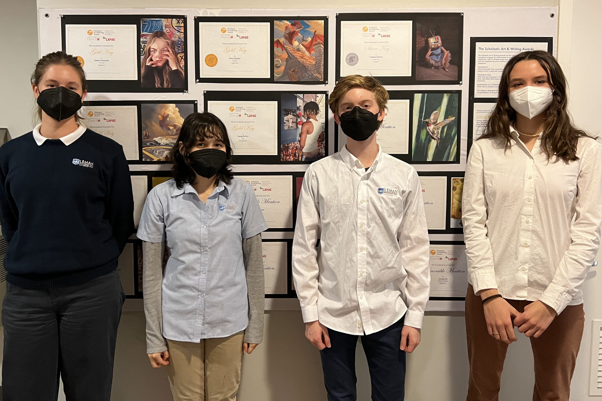 Students standing in front of artwork