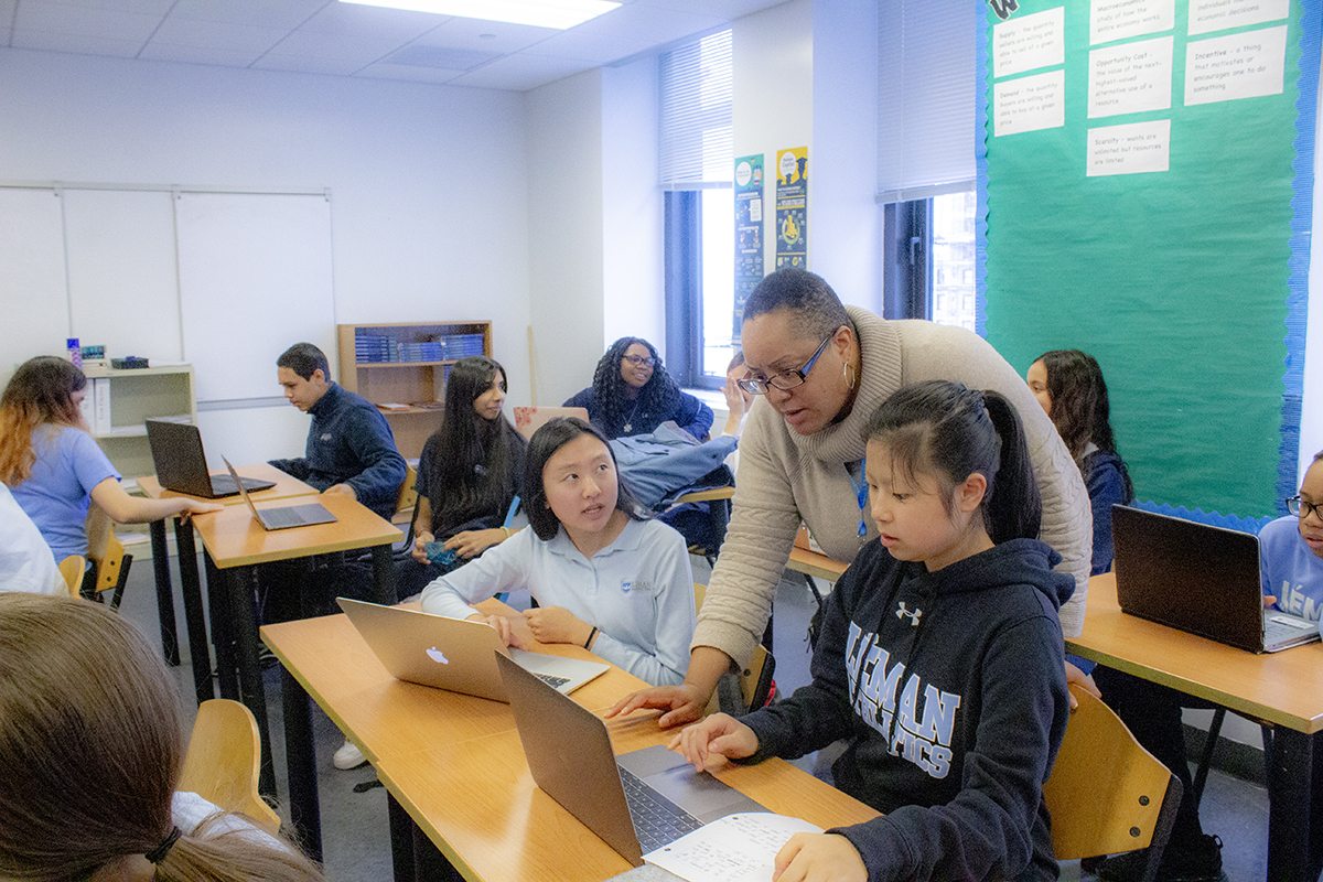 Teacher and students work together