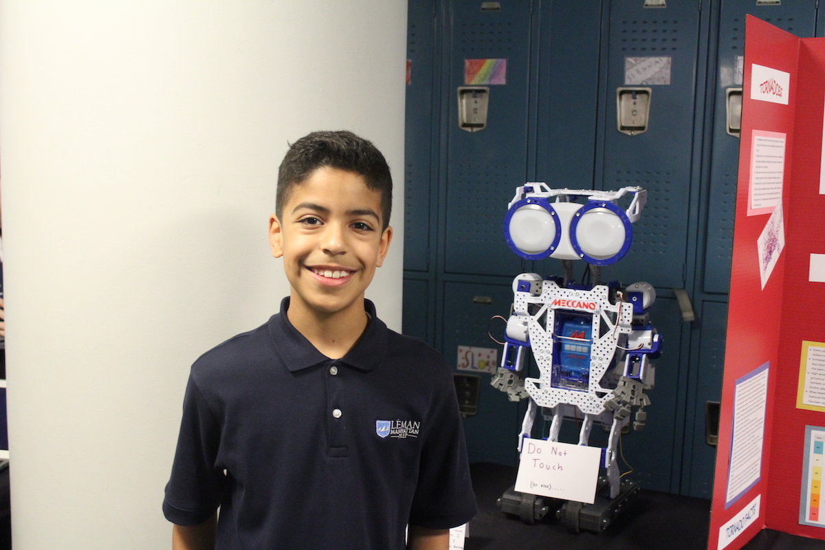 Boy standing next to presentation