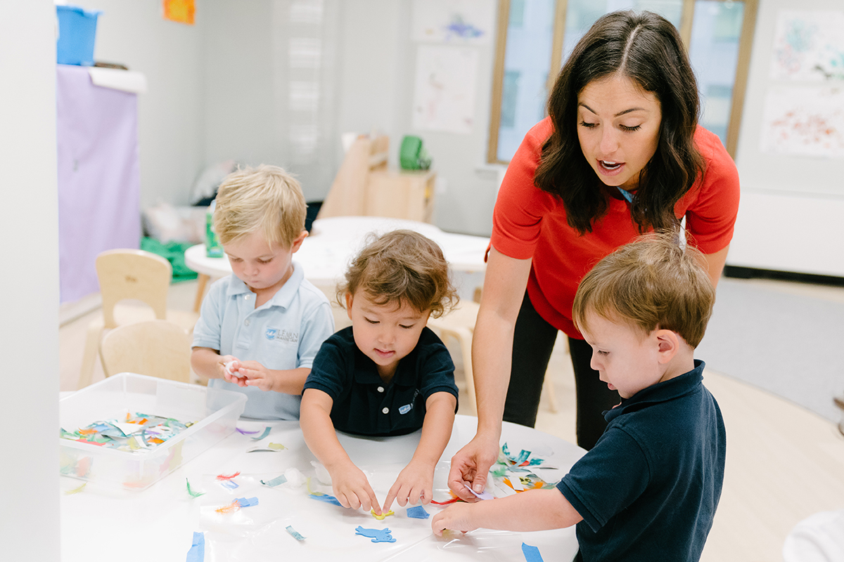 Teacher works with students in classroom