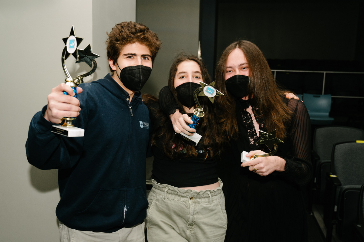 Students holding trophys