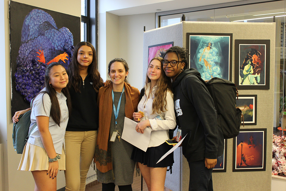 Students standing in front of art