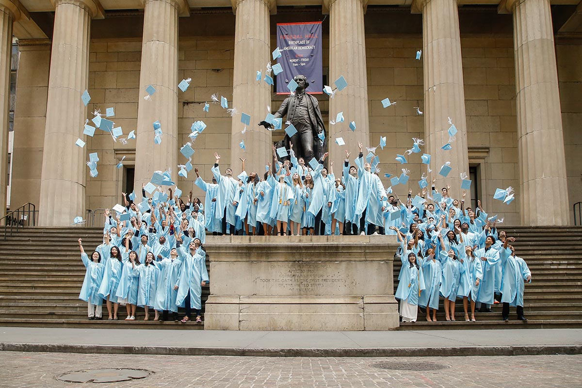 Graduates throwing caps in the air