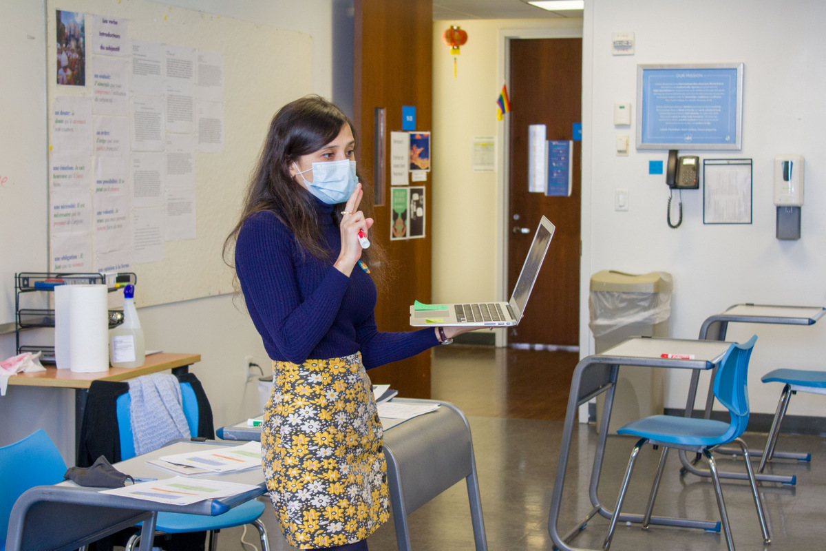 Teacher lectures in a classroom