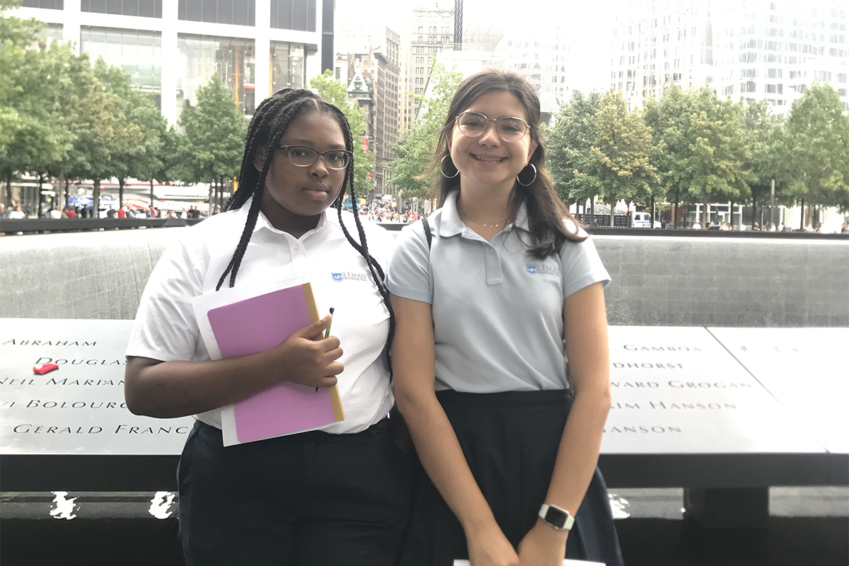 Girls standing in front of memorial fountain