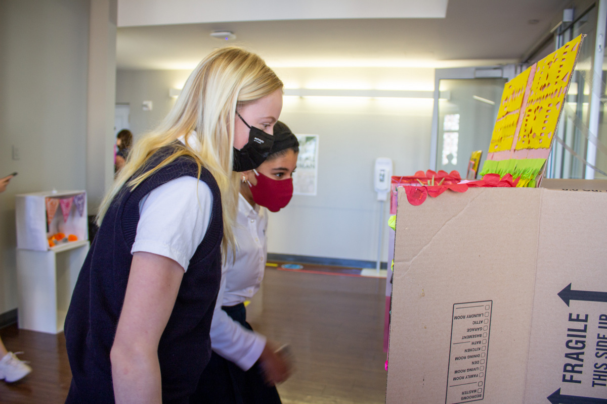 Students looking at a project